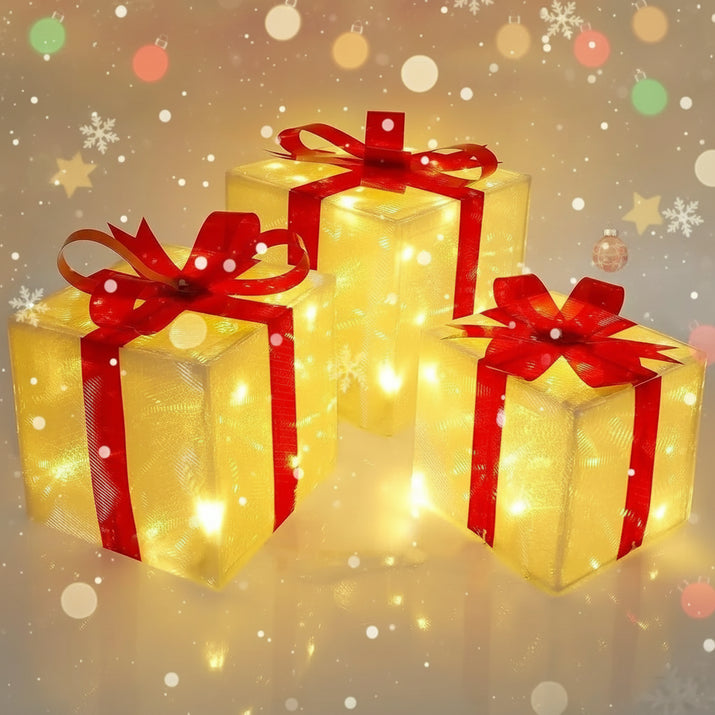 Three illuminated gift boxes with red ribbons on a neutral background