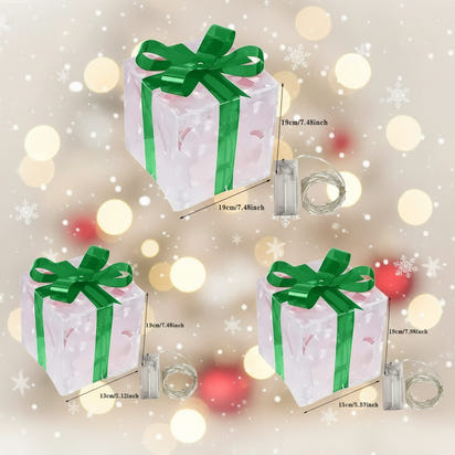 Set of three decorative gift boxes with green ribbons and measurements on a white background