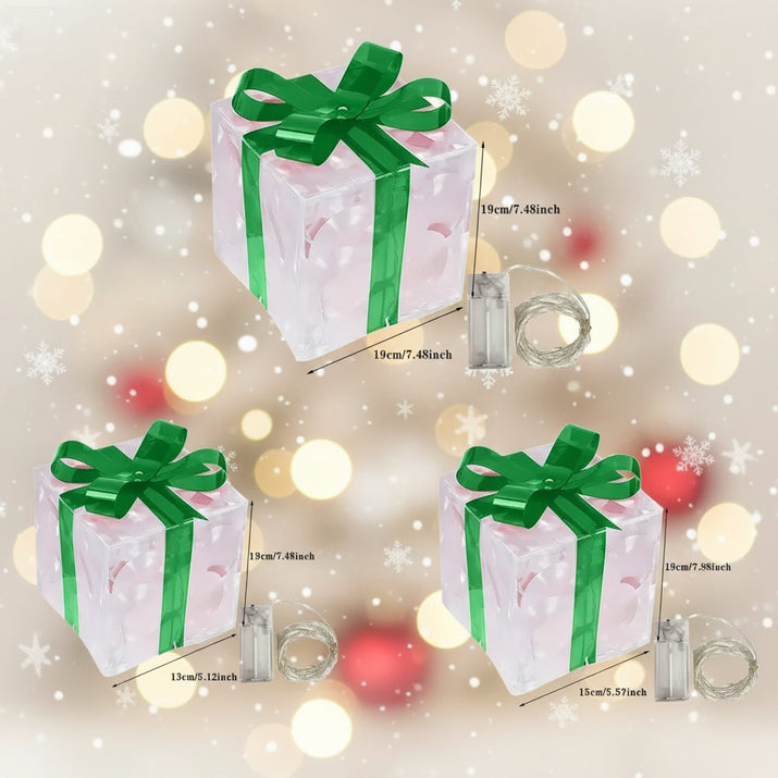 Set of three decorative gift boxes with green ribbons and measurements on a white background
